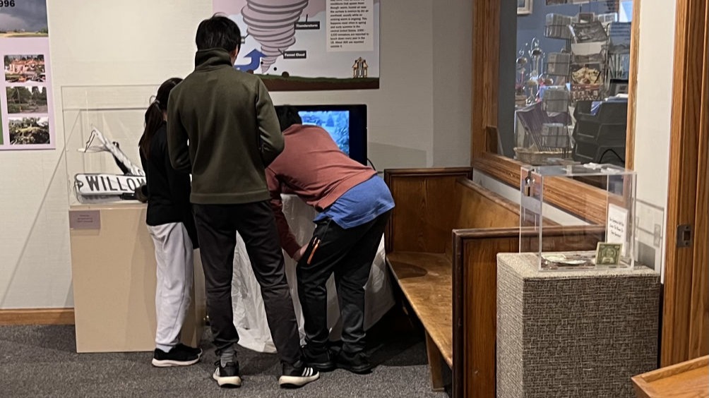 Kids watching the news footage and tornado